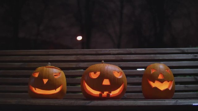 Tower of three terrible pumpkins. Halloween party smile and horror