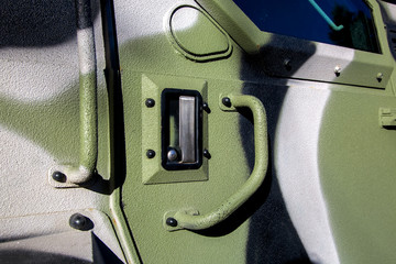 Handle for opening an armored military truck to suppress aggression, close-up of a closed lock with...