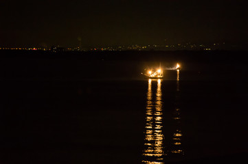 Fishing boat at midnight