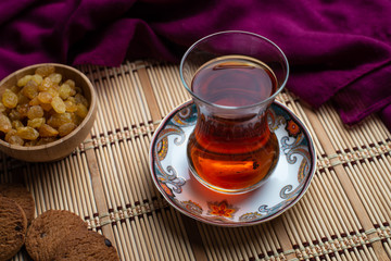 Homemade oatmeal cookies with a cup of tea on old wooden background, A cup of tea with raisin, a cup of tea with chocolate