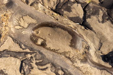 wet sand in the stone grooves