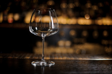 Empty burgonya glass on the bar counter