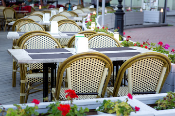 terrace summer cafe with tables and chairs for people, an empty institution for recreation, nobody.