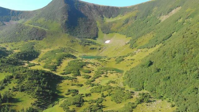 Flying over beautiful lake in Carpathians, Svydovets, Ukraine