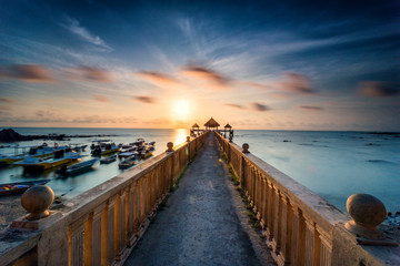 Obraz premium Beautiful long exposure sunrise shot at jetty. Image contain certain grain or noise and soft focus when view at full resolution