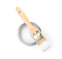 Paint can with brush on white background, top view