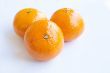 Fresh orange citrus fruit on white
