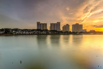 Obraz premium Beautiful landscape abstract citybackground and The light of sun reflection building on water.Panoramic and perspective wide angle skyscraper commercial modern city of future. pastel concept.