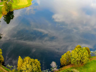 lake from above like a mirror with clouds
