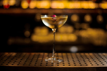 Delicious Twinkle cocktail decorated with one red berry