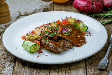 Beef cheeks on white plate