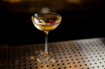 View from above delicious Twinkle cocktail decorated with one red berry