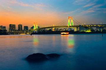 Fototapeta na wymiar Colorful illuminations at Rainbow Bridge from Odaiba in Tokyo, Japan