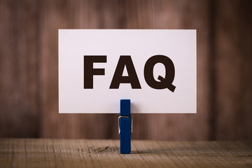 FAQ Sign With Wooden Background - obrazy, fototapety, plakaty