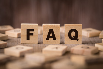 FAQ Sign With Wooden Background - obrazy, fototapety, plakaty