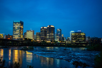 Fototapeta na wymiar Nightime cityscape view of Richmond, Virginia, USA across the James River