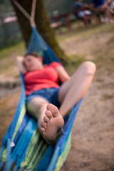 Fototapeta na wymiar woman resting on hammock