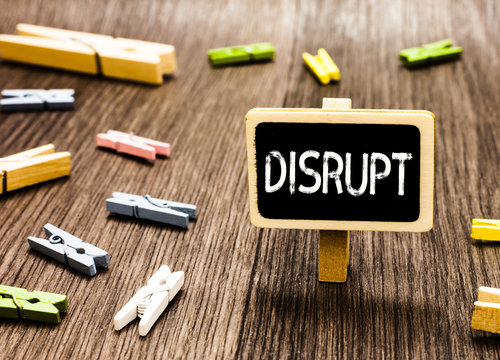 Handwriting text writing Disrupt. Concept meaning Interrupt causing disturbance problem Make something different Blackboard standing several clothespins disorganized messy wooden floor