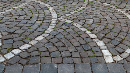 Scalloped pattern in road and footpath paving in Europe