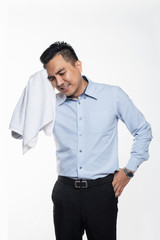 Asian man with work attire feeling exhausted and sweaty