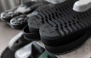 The conveyor on a shoes factory with shoe and sole. Mass production of footwear.