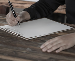 Lady holding pen, it's like a letter writer. Creative idea of work 2018 goals, writing, drawing,making notes in document.Business,investment,concept,Vintage ,Retro natural mood style. soft focus.
