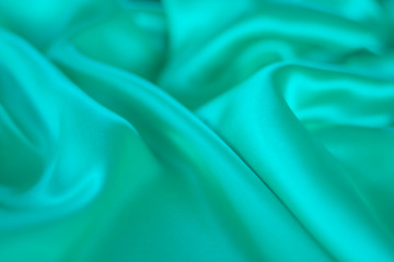 Obraz premium green silk texture,bakground, luxurious satin for abstract,design and wallpaper,soft and blur style,smooth,template.fabric drapery and Solid for backs and pillows.upholstery fabric from the courtyard.