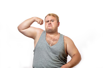Funny overweight fatso flexing his muscle with self -sure and confident expression, isolated on...