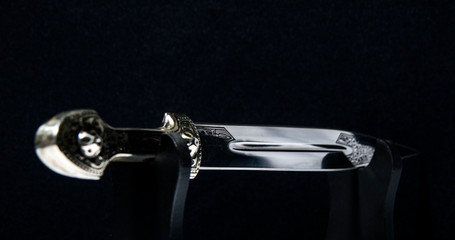 the dagger sword on a black background