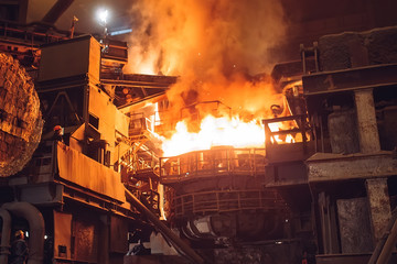 Melting of metal in a steel plant. High temperature in the melting furnace.