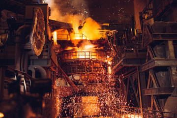 Melting of metal in a steel plant. High temperature in the melting furnace.