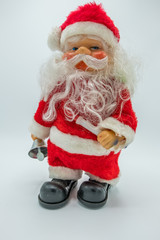 Vertical view of Santa Claus toy figure on white background.