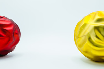 Red and golden christmas tree bauble on white.
