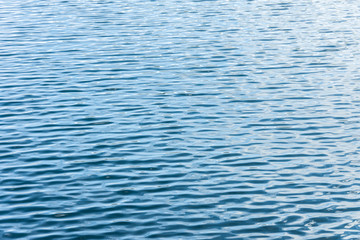 Ripple Water in swimming pool with sun reflection