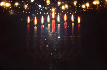 Image of jewish holiday Hanukkah background with menorah (traditional candelabra) and burning candles. - obrazy, fototapety, plakaty