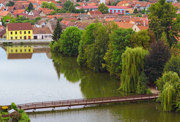 Fototapeta na wymiar Aerial view of Telc and castle lake with wooden bridge. Summer landscape. Telc, Southern Moravia, Czech Republic