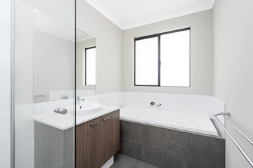 Fototapeta na wymiar Modern style large bathroom in new Australian home.