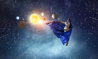 Obraz na płótnie Canvas Super woman in sky. Mixed media