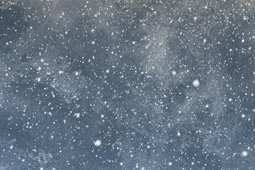 cement texture, dark gray concrete wall background with falling snowflakes