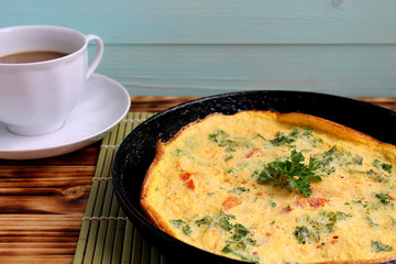scrambled eggs with vegetables in a pan