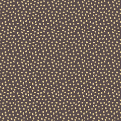 Seamless background with random golden elements. Abstract ornament. Dotted abstract pattern