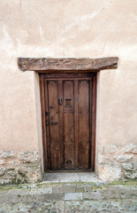 Wooden door in a stone wall