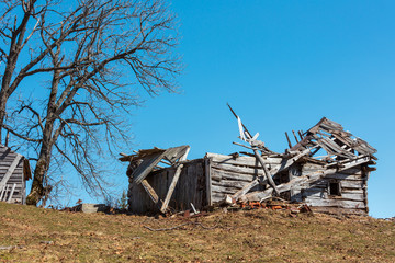 Ruined shed on early spring plateau