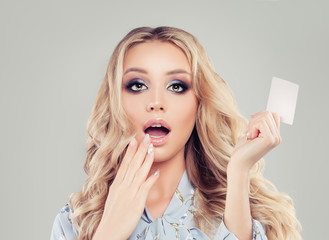 Happy surprised woman with credit card portrait