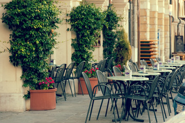 Montagnana, Italy August 6, 2018: cafe tables on a city street.