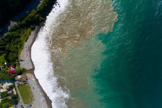 Storm and vacationers on the Black Sea coast.