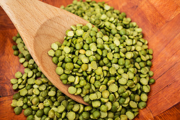 Dry peas with wooden spoon.