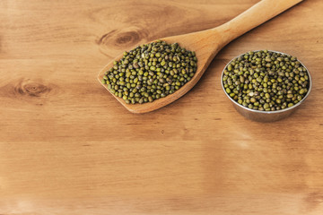 Moong beans in wooden plate.