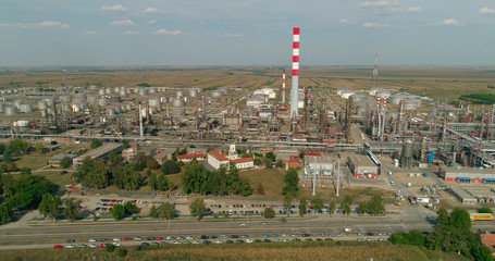 Oil refinery, drone shot. Industry, chimney. Cars, roads.