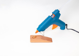 Blue glue gun  with a wood